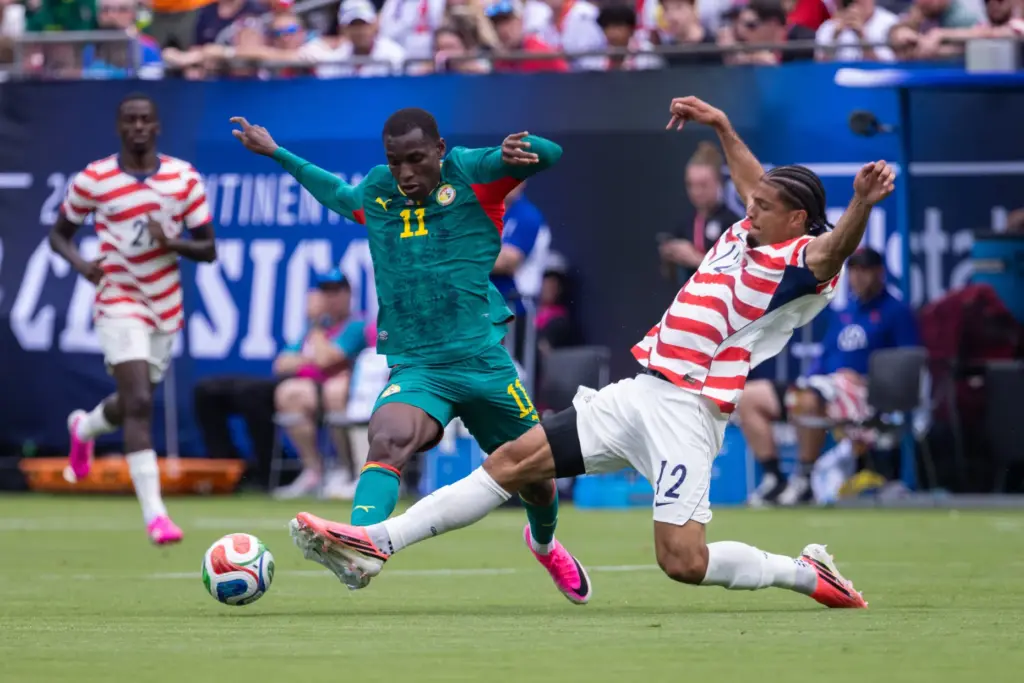 Senegal defender Nicolas Jackson (11) has the ball knocked away...