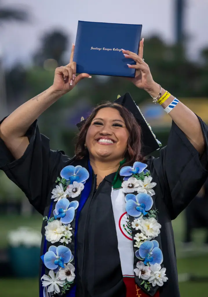 Graduate Andrea Cortez after receiving her diploma at Santiago Canyon...