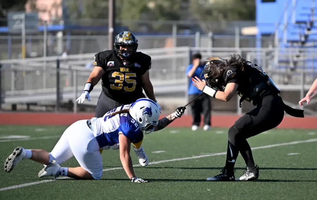 Cali War quarterback Tania Yareli Guzman is under pressure against...