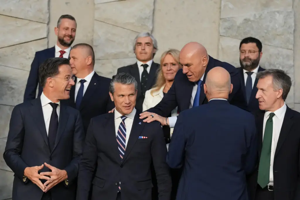 Italy’s Defense Minister Guido Crosetto, fourth right, greets United States...