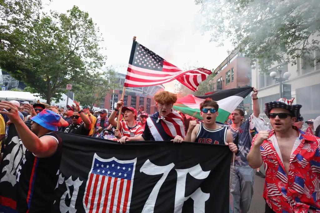 United States fans march to the match before the World...