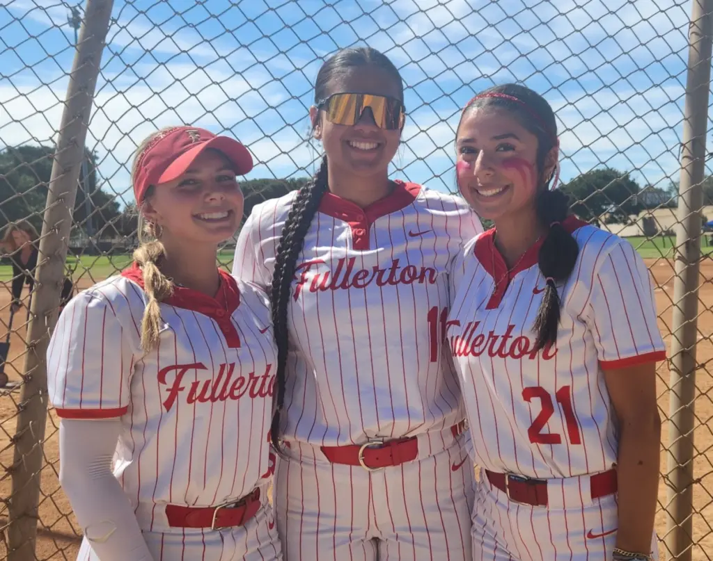 Fullerton’s Hayley Brock, left, hit two home runs, Malaya Majam-Finch,...