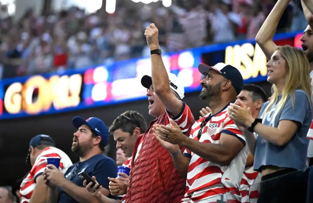 United States fans cheer a the U.S. takes a 2-0...