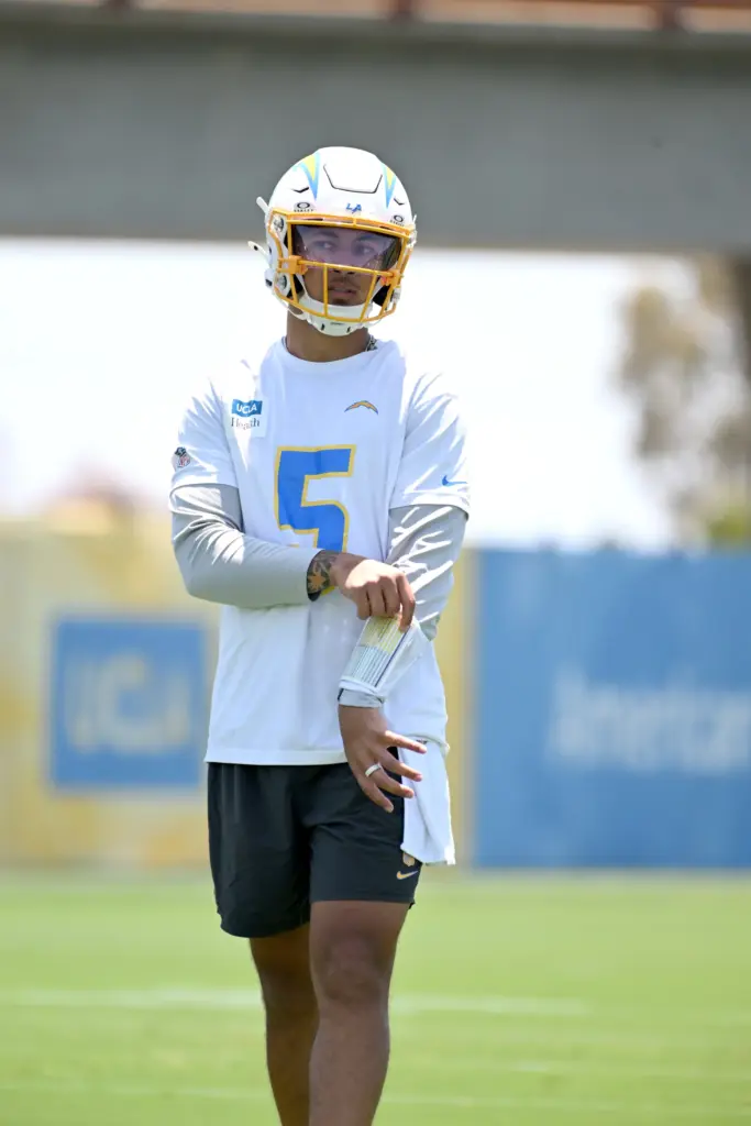 Chargers quarterbacks Justin Herbert (10) and Trey Lance (5) participate...