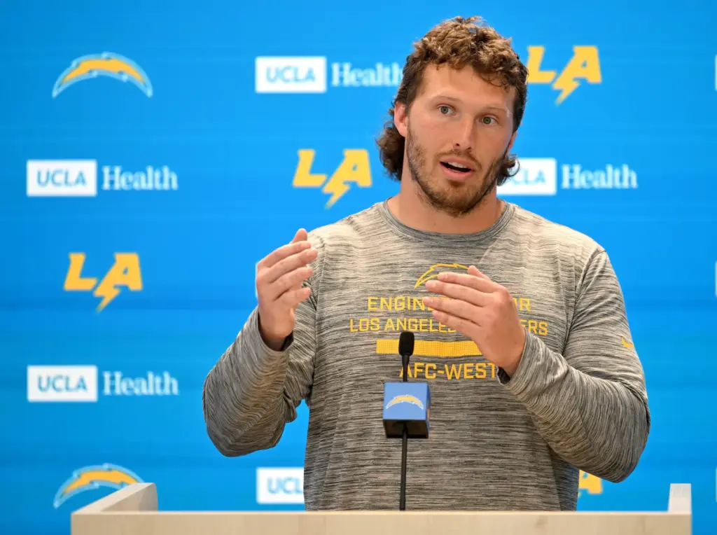Chargers offensive guard Cole Strange speaks to the media after...