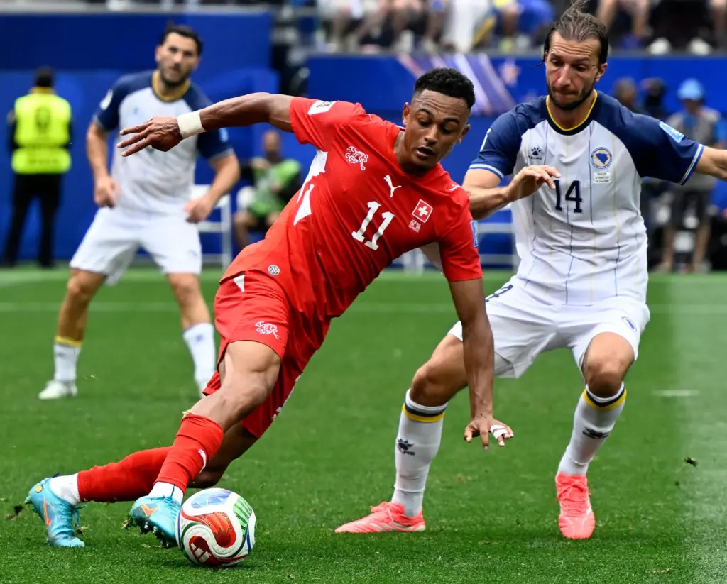 Switzerland forward Dan Ndoye (11) attempts to pass as Bosnia...