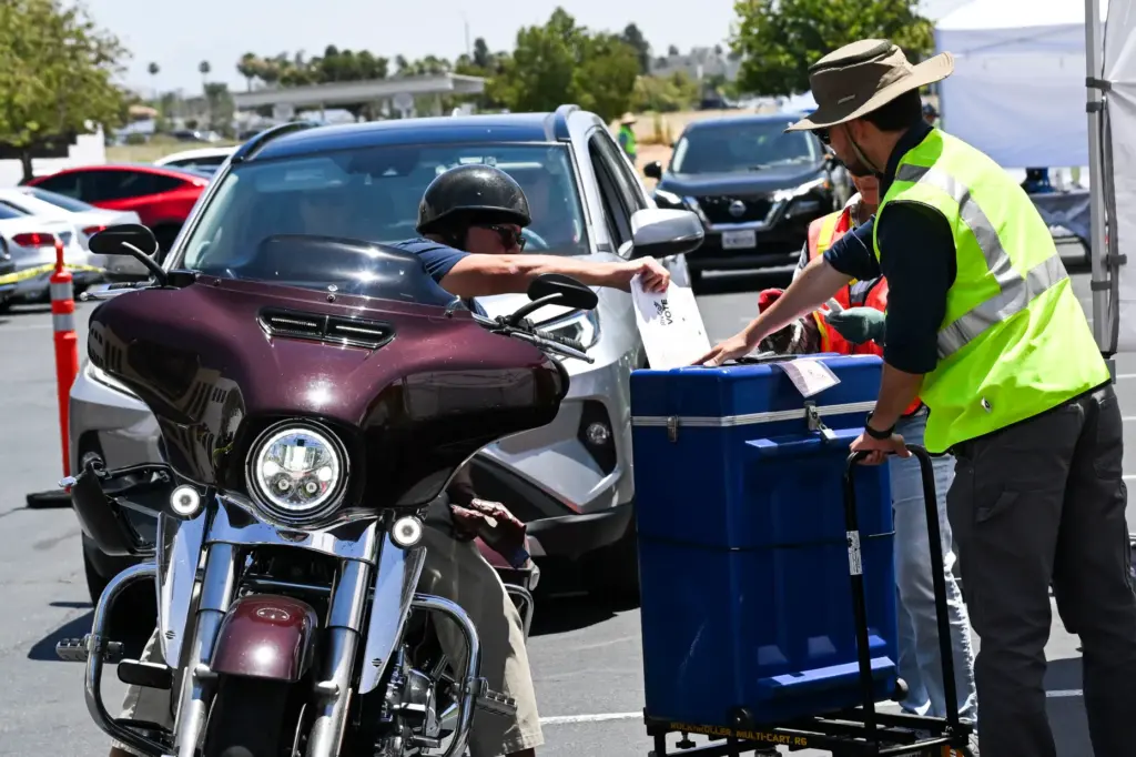 A drive-through ballot drop-off station is set up Monday, June...