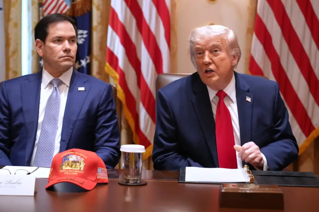 President Donald Trump, next to Secretary of State Marco Rubio, speaks during a Cabinet meeting.