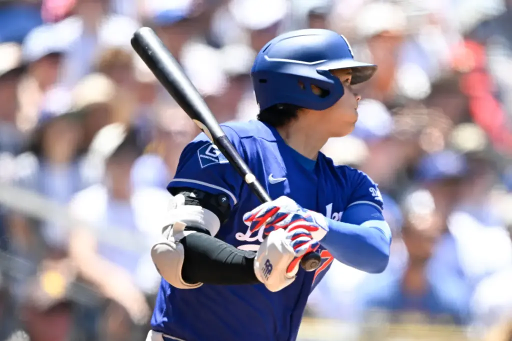 Dodgers designated hitter Shohei Ohtani watches his RBI single during...