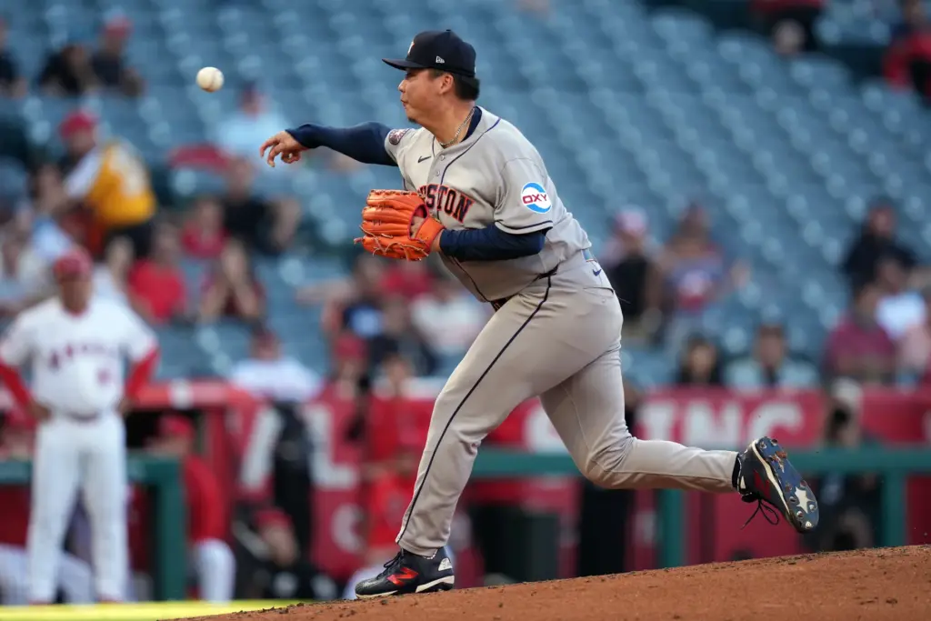 Houston Astros starting pitcher Kai-Wei Teng throws to the plate...
