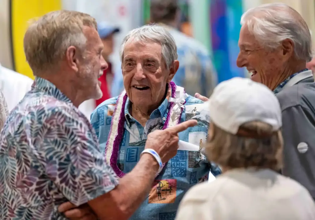 Dick Metz, center, founder of the Surfing Heritage and Culture...