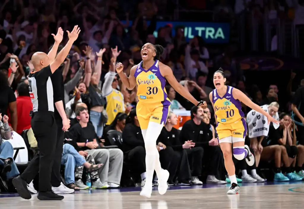 Los Angeles Sparks Nneka Ogwumike (30) reacts after taking the...
