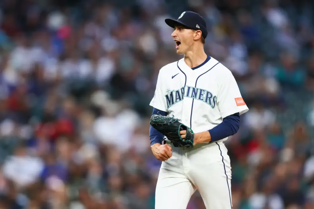 Seattle Mariners relief pitcher George Kirby reacts after striking out...
