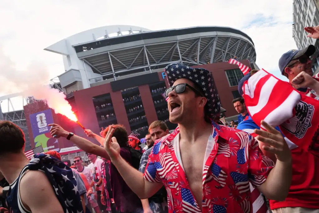 A group of United States fans arrive outside the stadium...