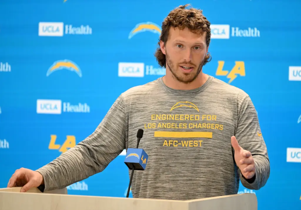 Chargers offensive guard Cole Strange speaks to the media after...
