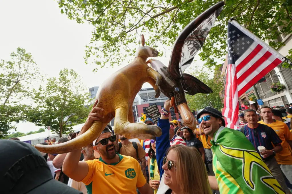 Australia and United States fans pit their mascot kangaroo and...
