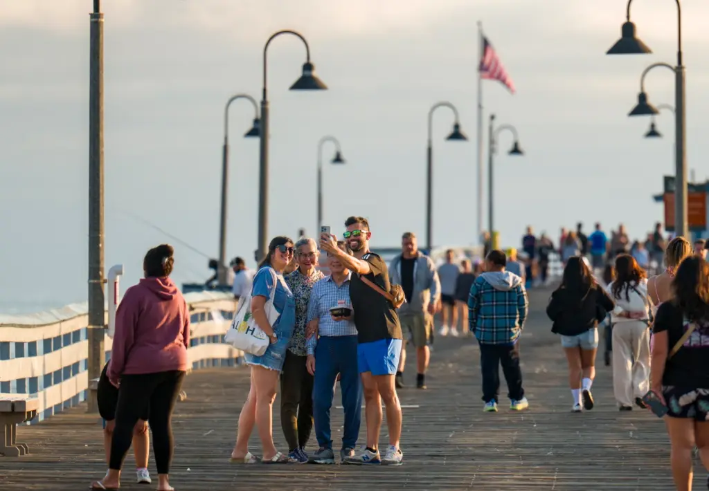 A group of people take a selfie on the San...