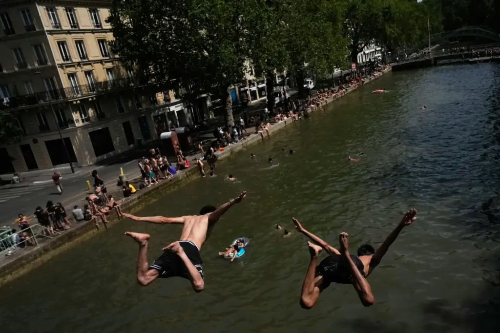 Parisians bathe in the Canal Saint-Martin in Paris.