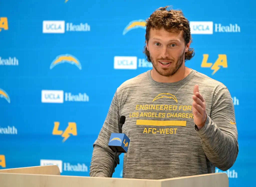 Chargers offensive guard Cole Strange speaks to the media after...