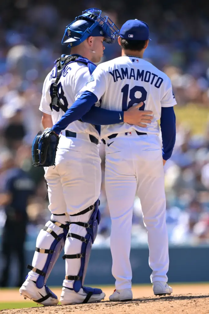 Los Angeles Dodgers catcher Dalton Rushing, left, congratulates Dodgers starting...