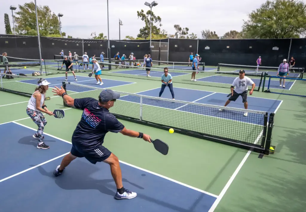 Steve Ralph of Laguna Niguel hits the ball while competing...