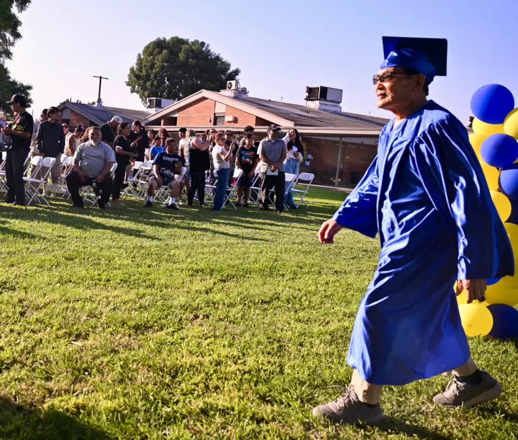 Soo Hak Kwon, 91, makes his way to his seat...