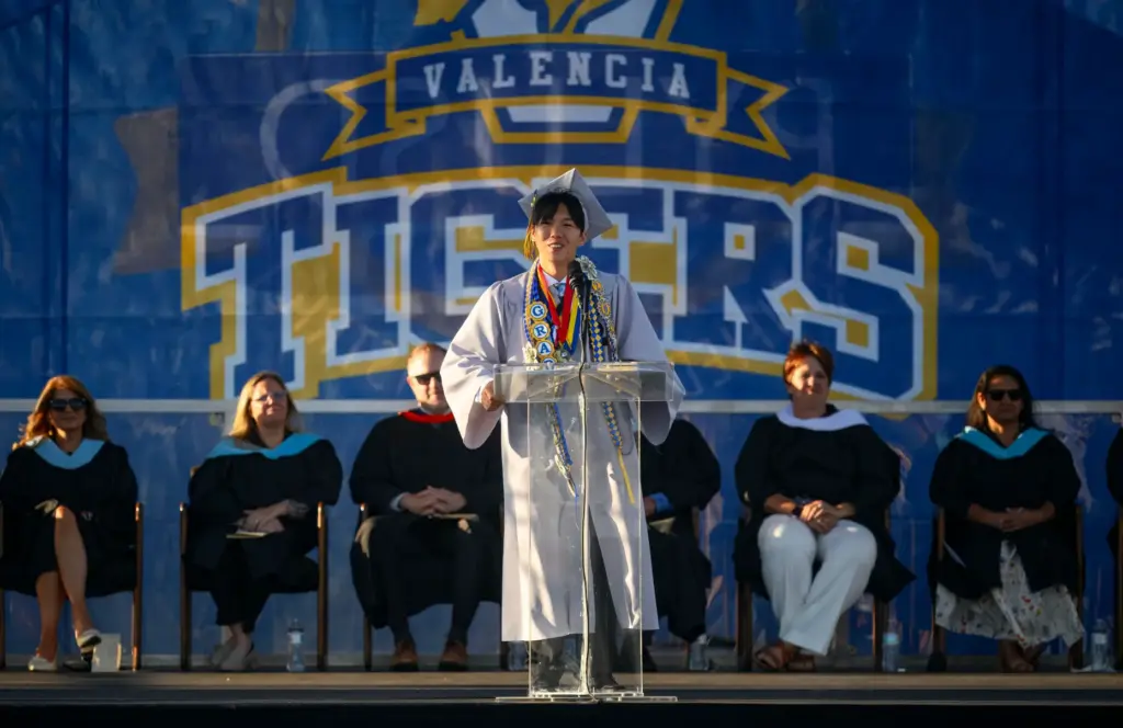 Dylan Nguyen delivers one of the commencement addresses during the...