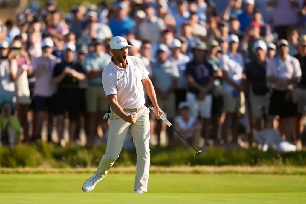 Wyndham Clark celebrates after a birdie on the 16th hole...