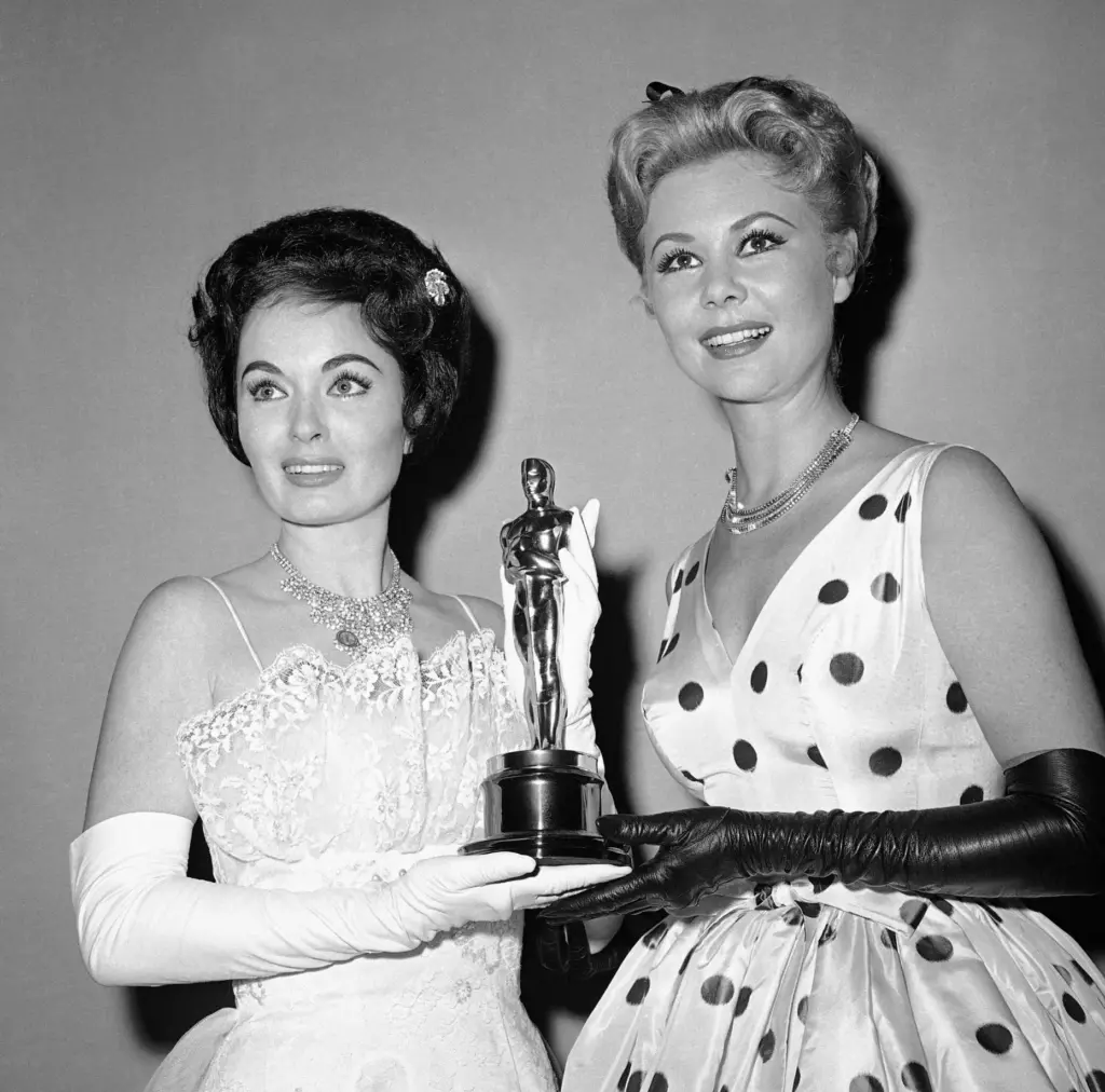 FILE – Ann Blyth, left, and Mitzi Gaynor hold an...