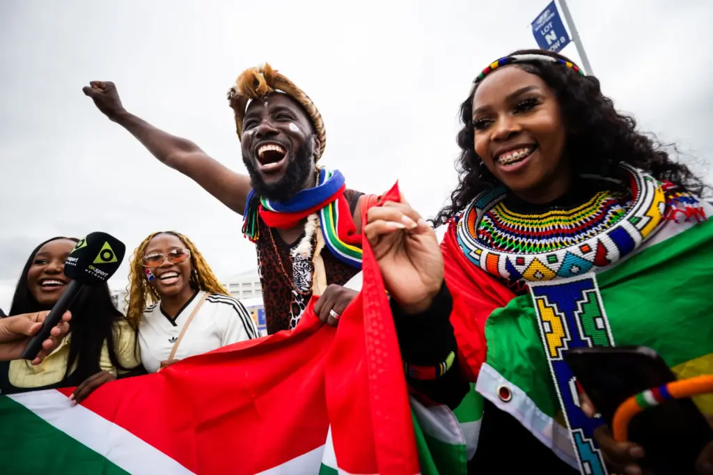 South Africa fans celebrate before a World Cup round of...