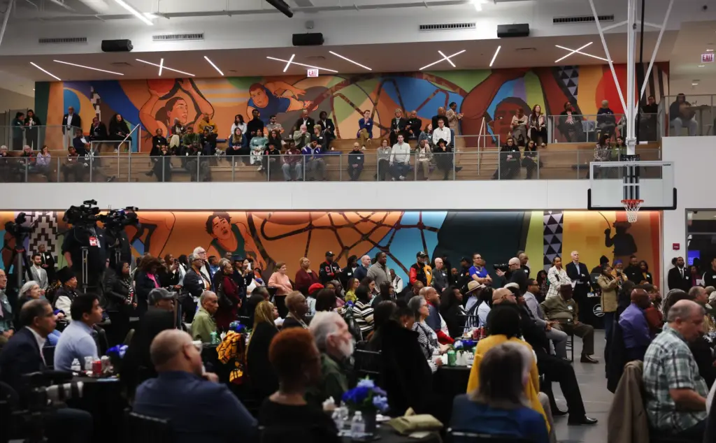 People attend a program inside Home Court at the Obama...
