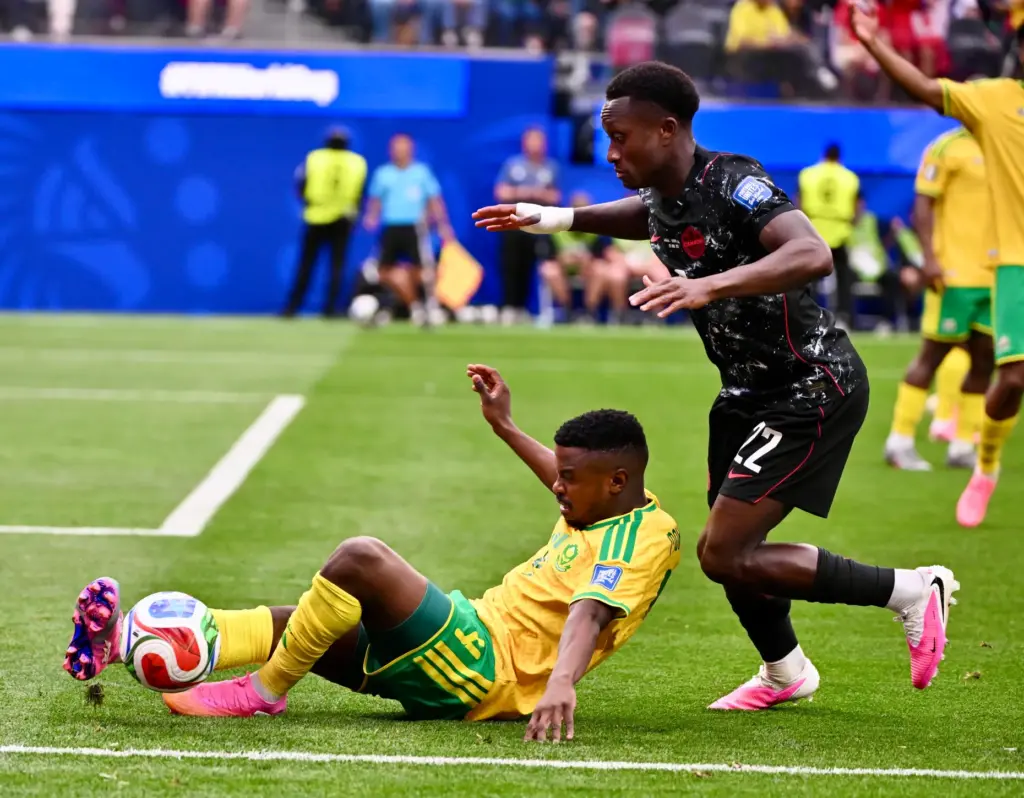 South Africa midfielder Teboho Mokoena (4) slides for the ball...