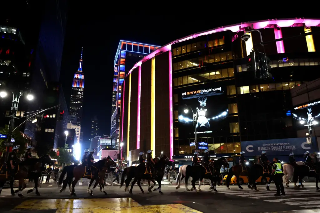 New York City police on horseback patrol the street by...