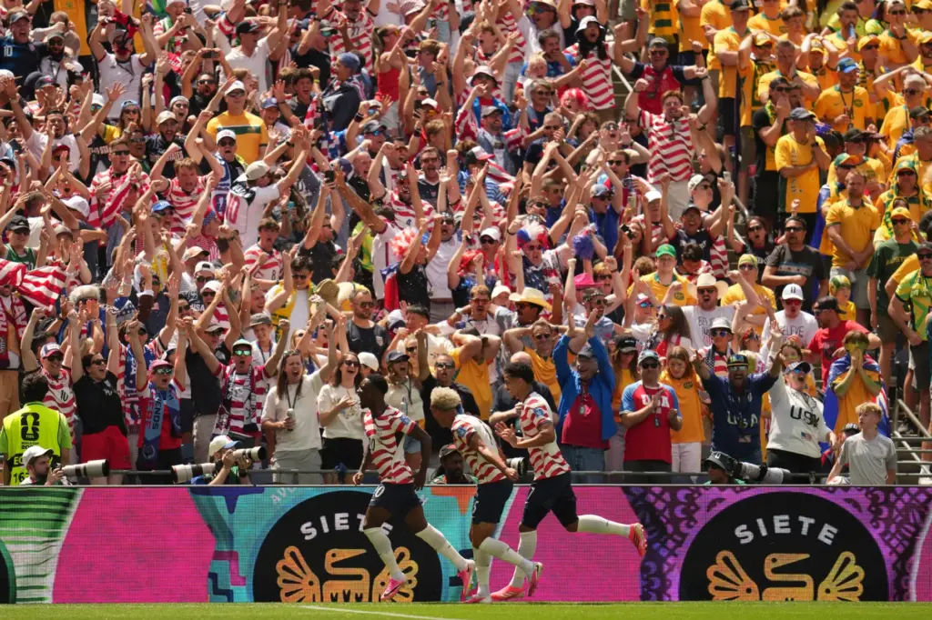 US players celebrate the opening goal of their team during...
