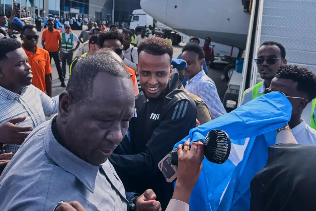 Referee Omar Artan is welcomed by supporters upon his arrival in Mogadishu, Somalia.