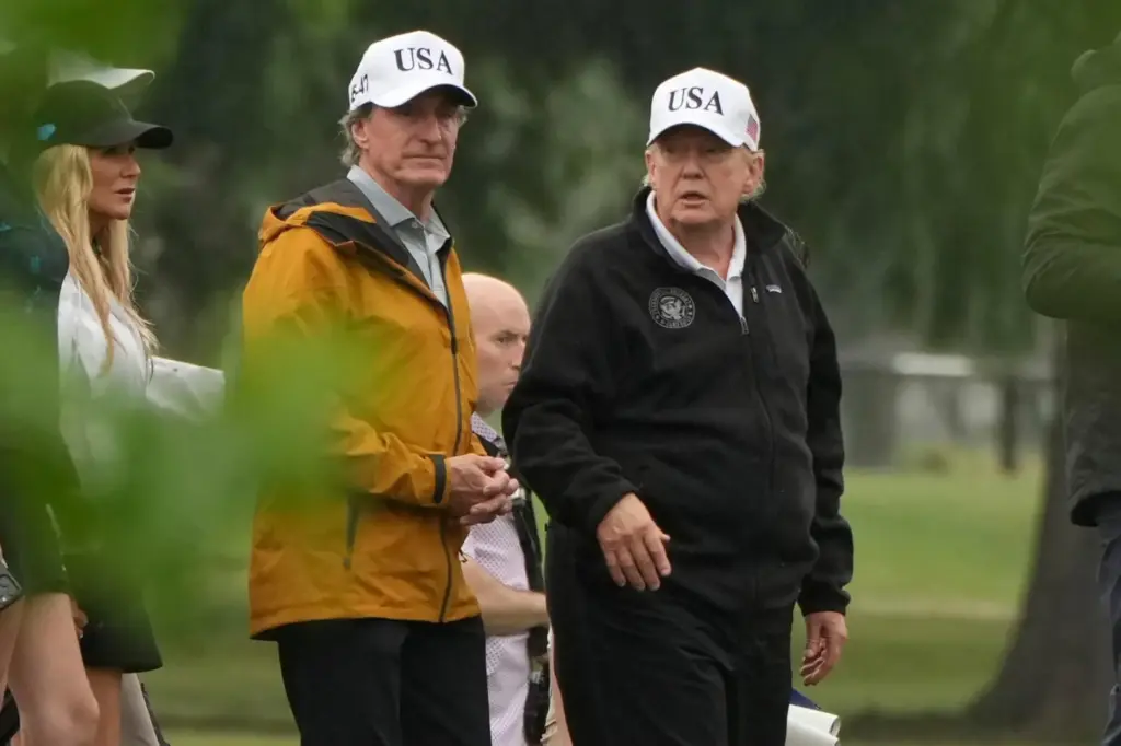 President Donald Trump, from right, and Interior Secretary Doug Burgum...