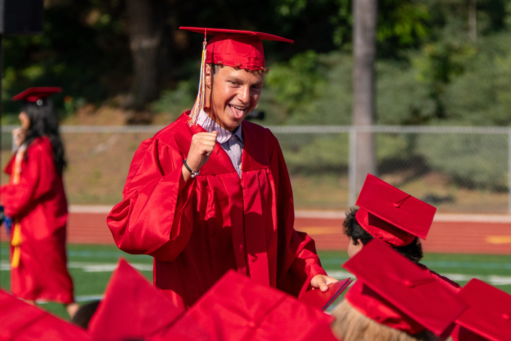 Woodbridge High School senior Max Stewart, celebrates during the schoolâs...