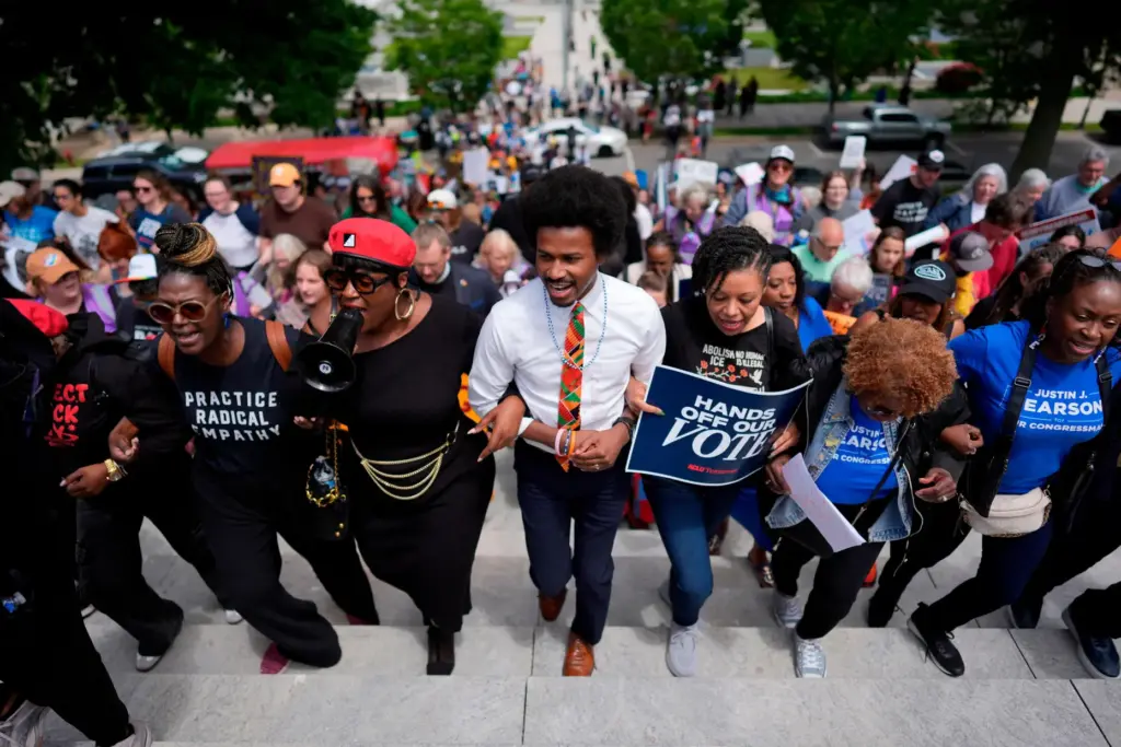 Rep. Justin J. Pearson, D-Memphis, center, marches with protesters before...