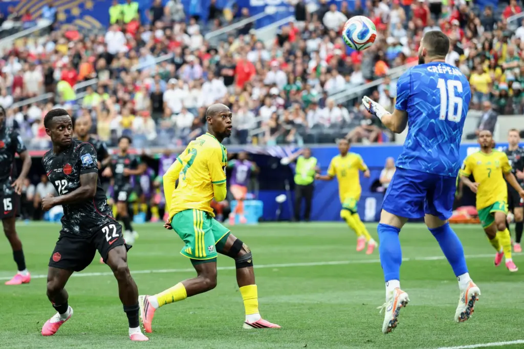 Canada goalkeeper Maxime CrÃ©peau (16) catches the ball as South...