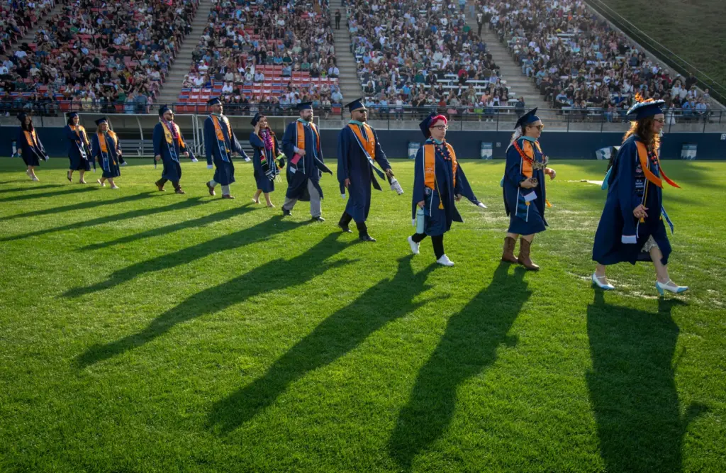 Students make their way to their seats during CSUF College...