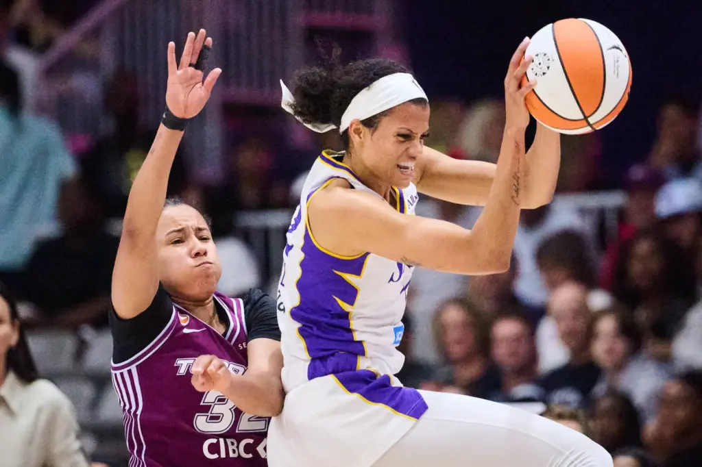 The Sparks’ Rae Burrell, right, catches the ball over Toronto...