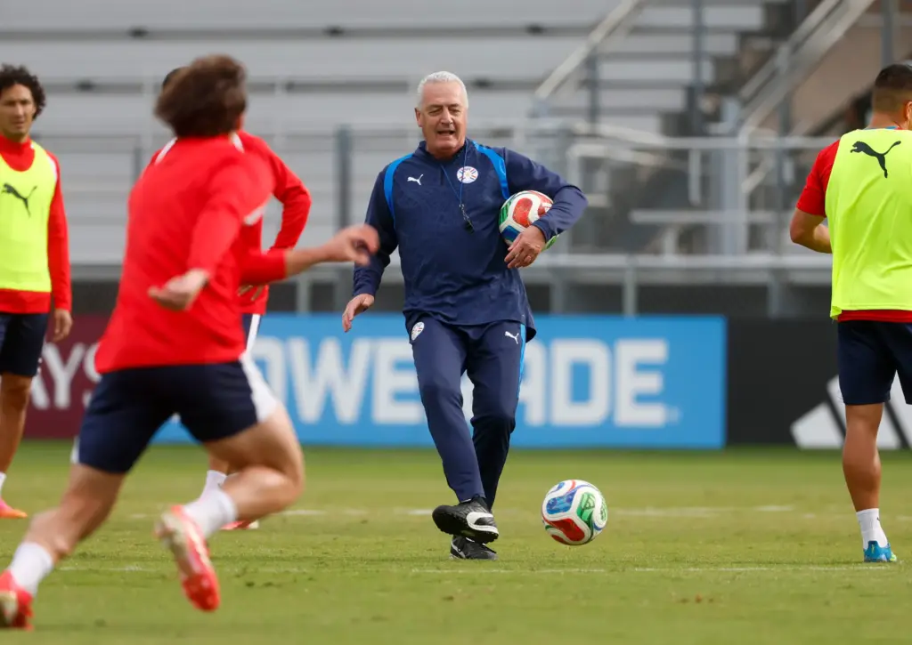 Paraguay’s national soccer team head coach Gustavo Alfaro kicks the...