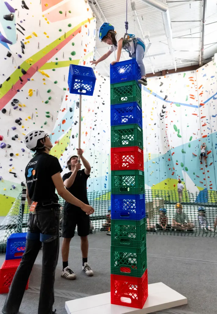 Lyanna Su, 6, does a crate stacking exercise during Rock...