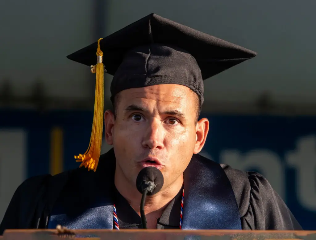 Valedictorian Jeno Jorgensen addresses the audience at Santiago Canyon Collegeâs...