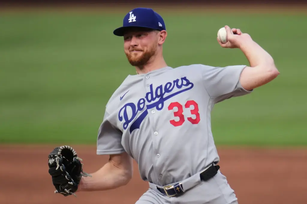 Dodgers starting pitcher Eric Lauer throws to the plate during...