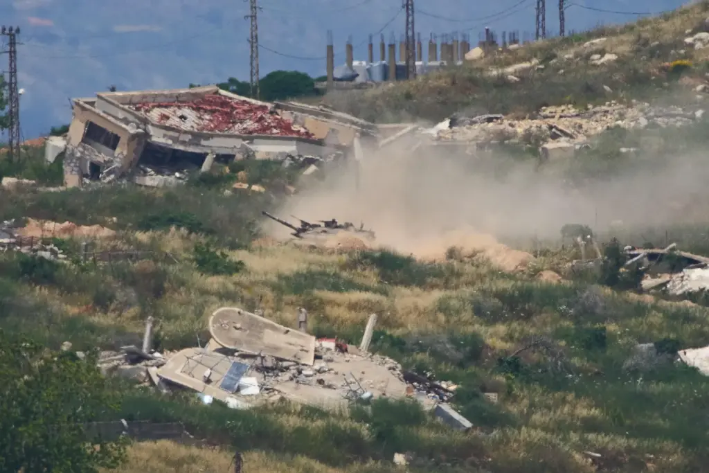 Israeli soldiers drive a tank in southern Lebanon as seen...