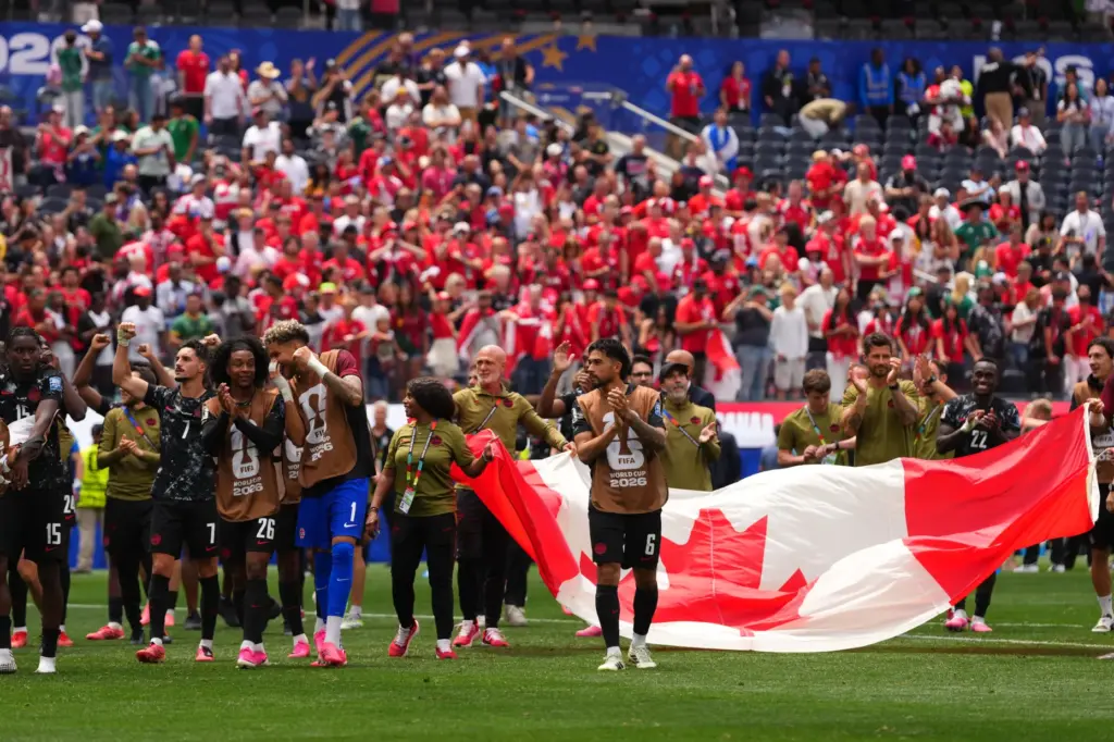Canada players celebrate after the World Cup round of 32...