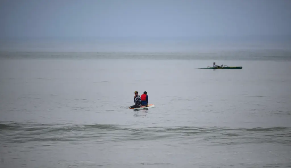 Surfers Healing volunteers give children on the autism spectrum a...