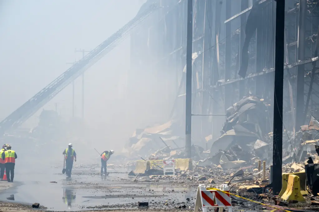 DWP workers in smoke at the Lineage warehouse fire in...
