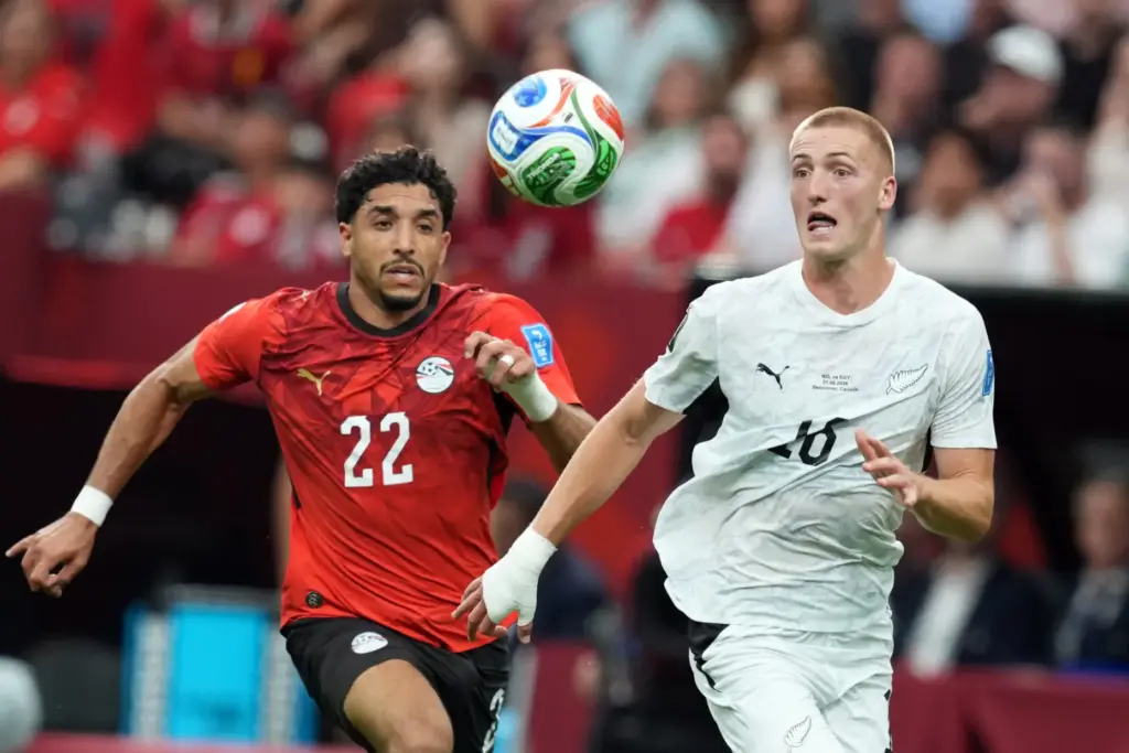 Egypt’s Omar Marmoush (22) and New Zealand’s Finn Surman, right,...